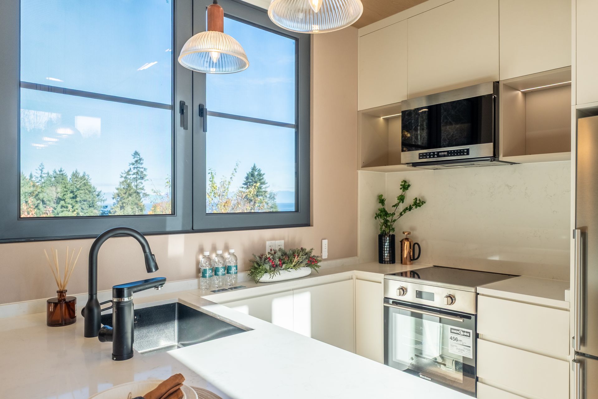 A house with a deck and chairs in front of it