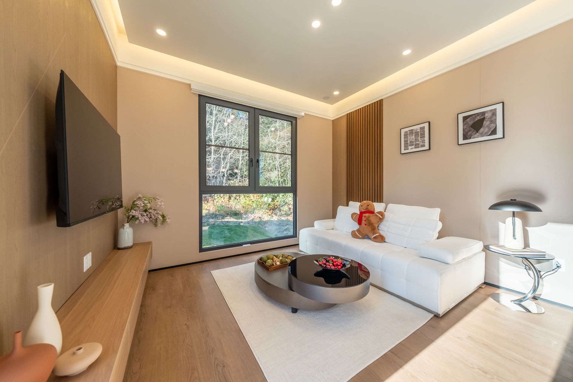 A living room with a couch , table , and sliding glass doors.