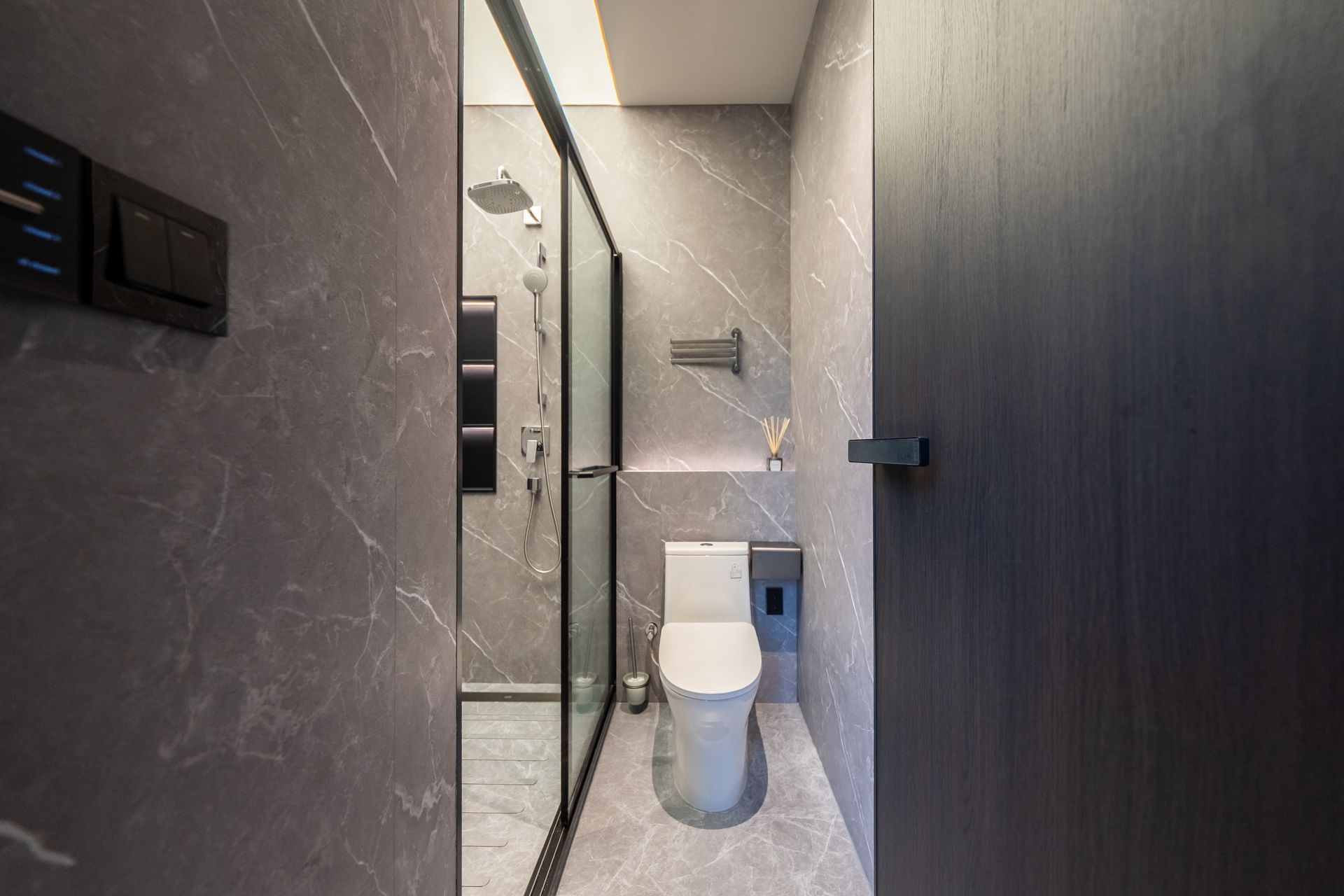 A living room with wooden shelves and a flat screen tv