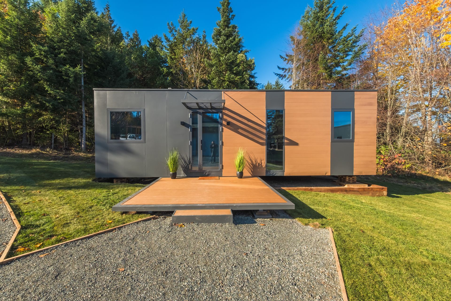 A model of a house and a model of a house on a white background.