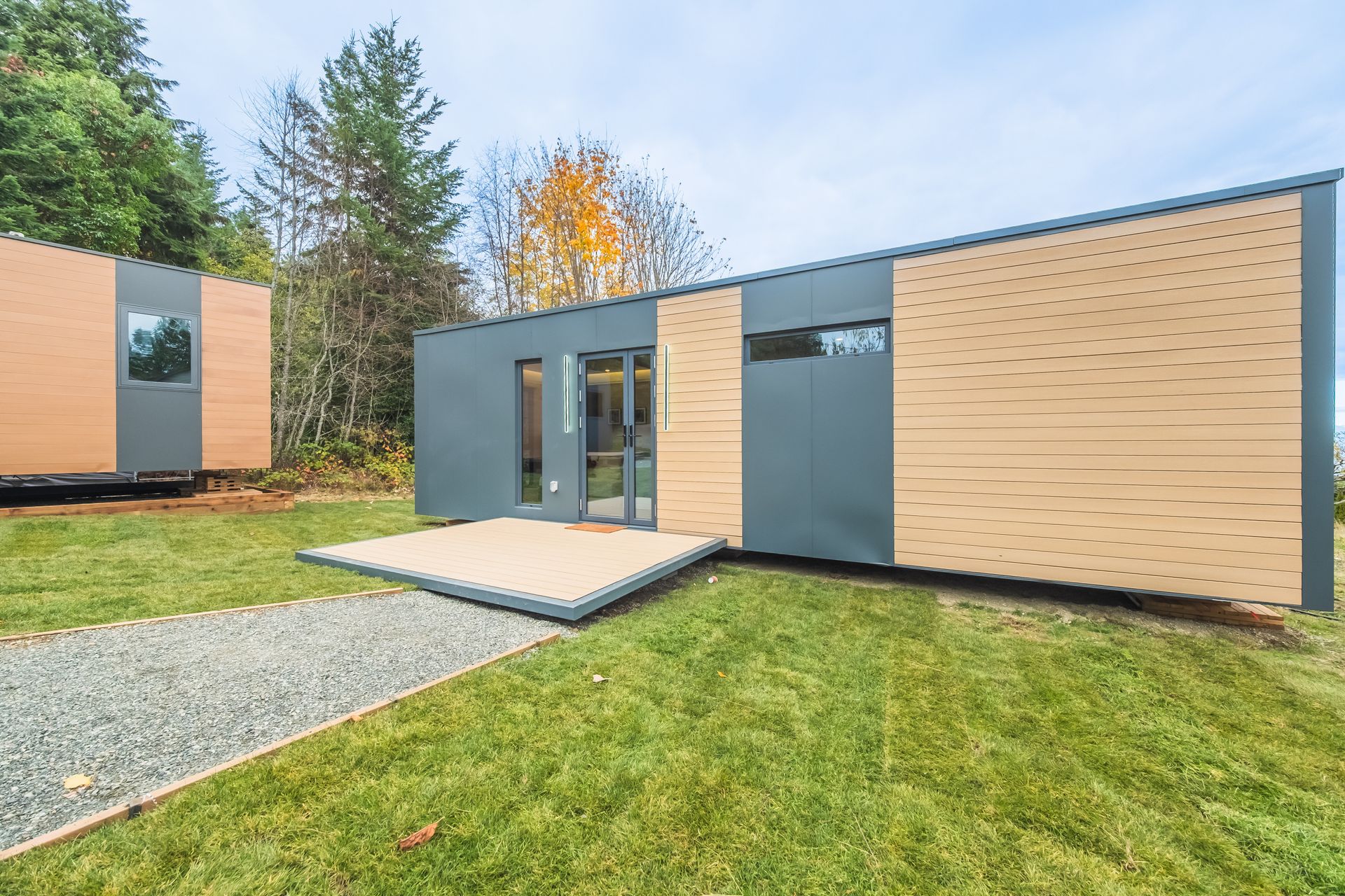 A small house with a lot of windows and doors