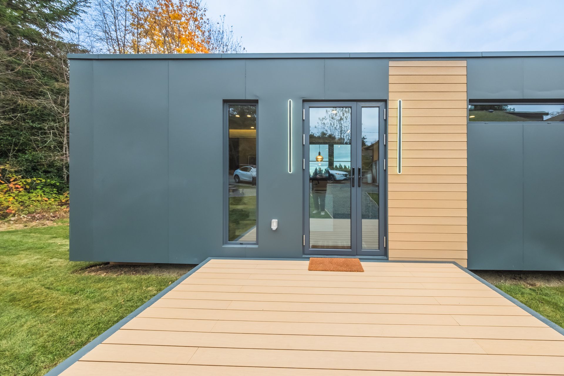 A modern house with a large deck and stairs