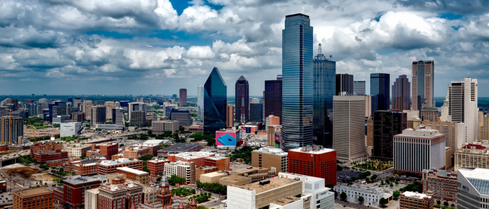 An aerial view of a city skyline on a cloudy day.