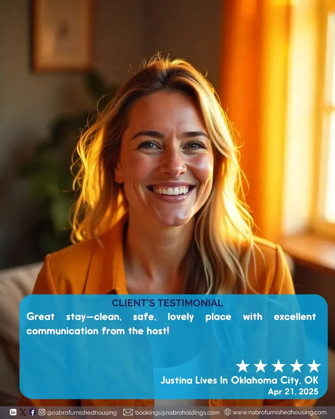 A woman is smiling while sitting on a couch.