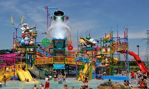 A group of people are playing in a water park.