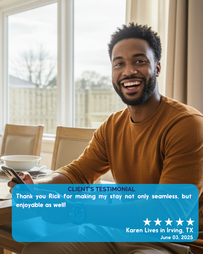 A man is sitting at a table with a cell phone in his hand ..