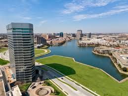 An aerial view of a city surrounded by water and buildings.