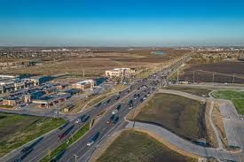 An aerial view of a busy intersection with a lot of traffic.