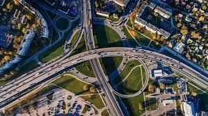 An aerial view of a busy highway intersection in a city.