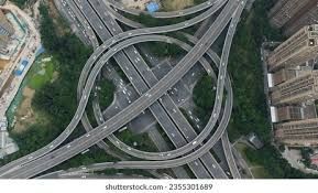 An aerial view of a highway intersection in a city.