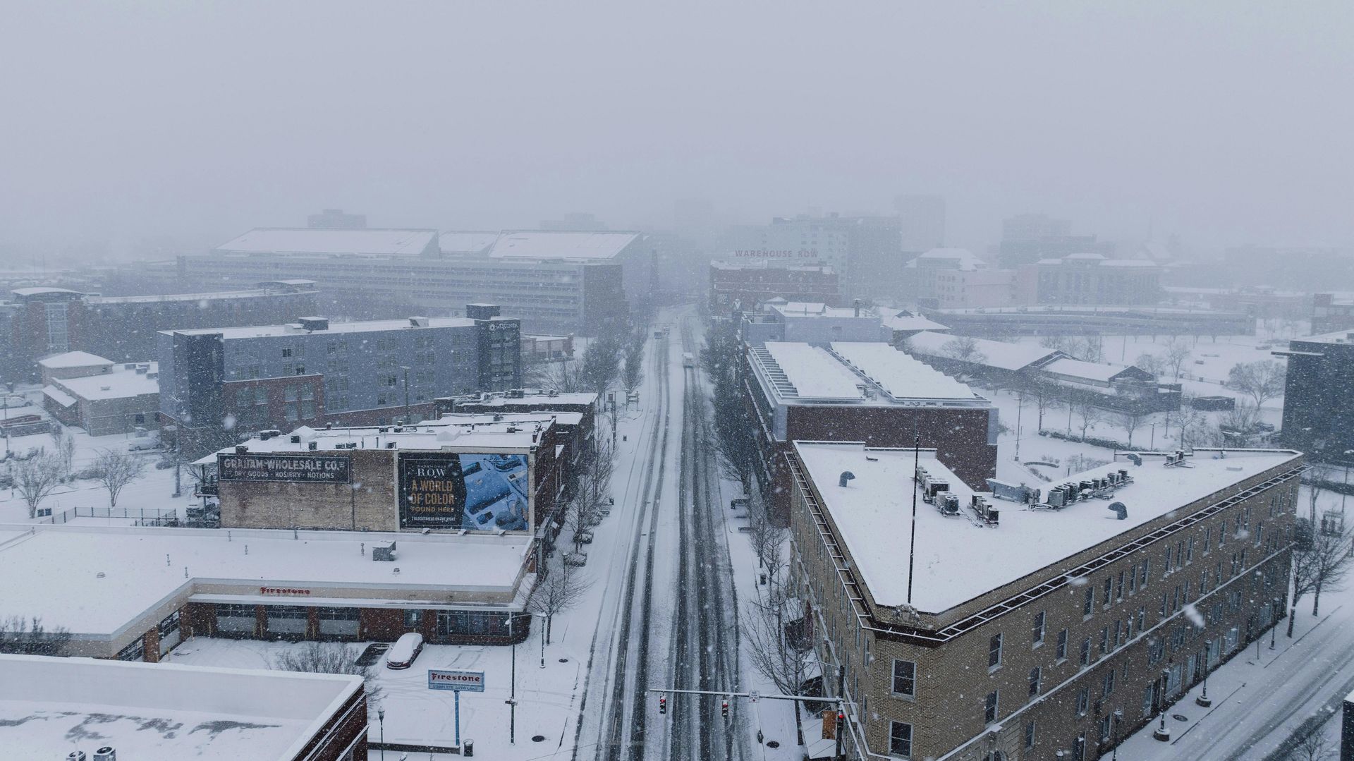 An aerial view of a city covered in snow.