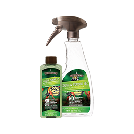 A spray bottle and a bottle of duck starter on a white background.