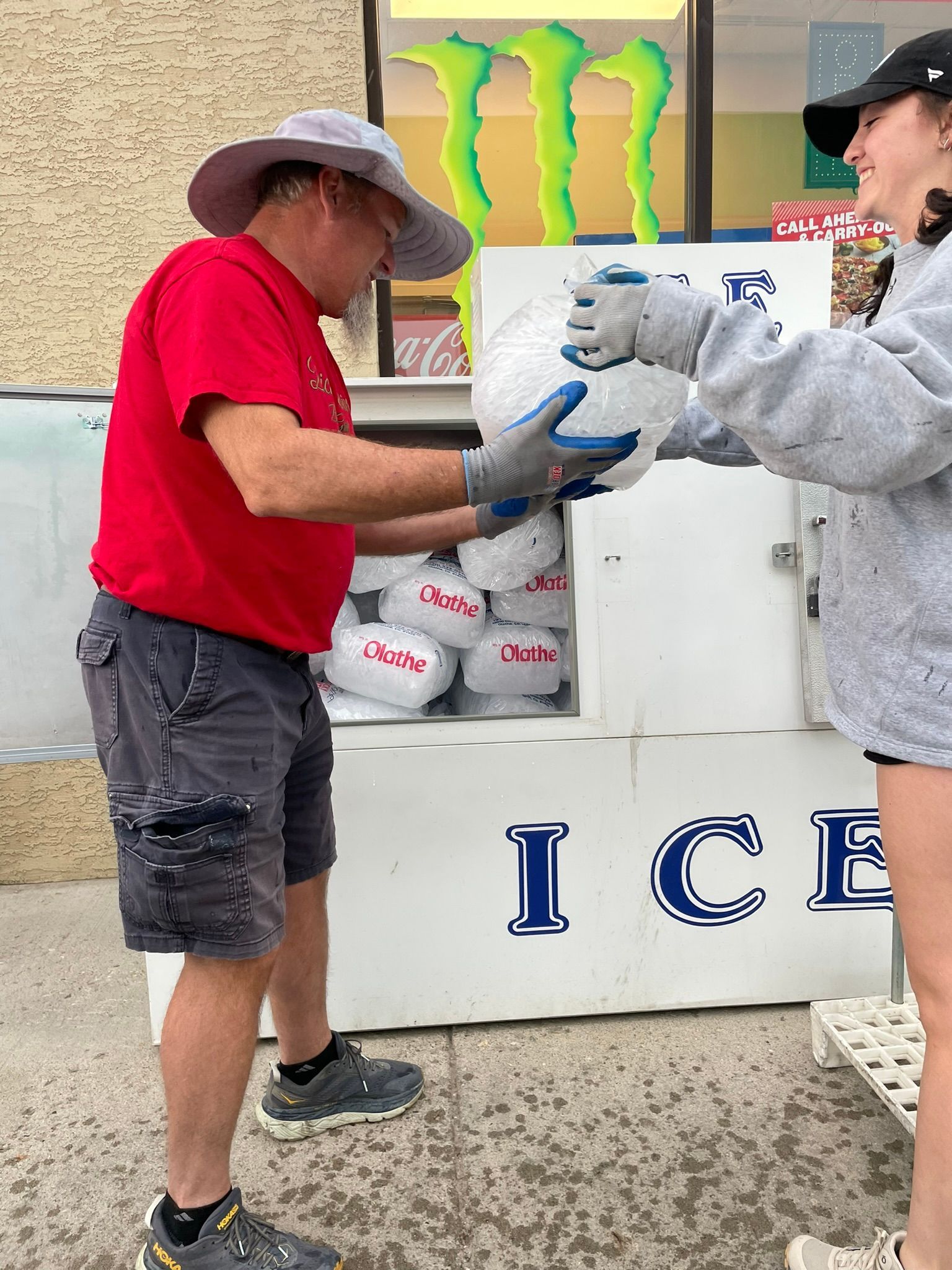 gunnison ice owner giving ice to woman