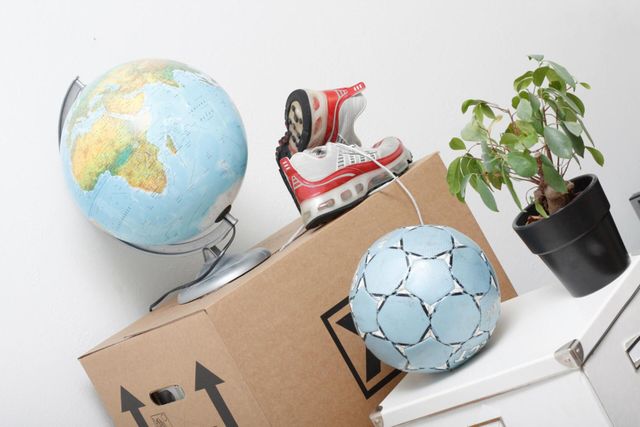 a globe, shoes and ball