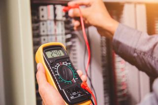 Electrician Measuring Voltage — Forrest, IL — RTJ Electric