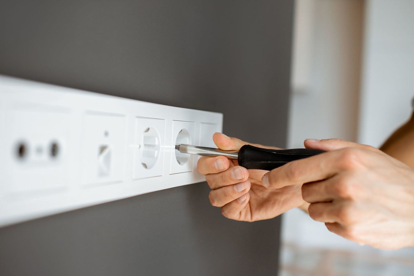 Electrician Mounting Electric Sockets — Forrest, IL — RTJ Electric