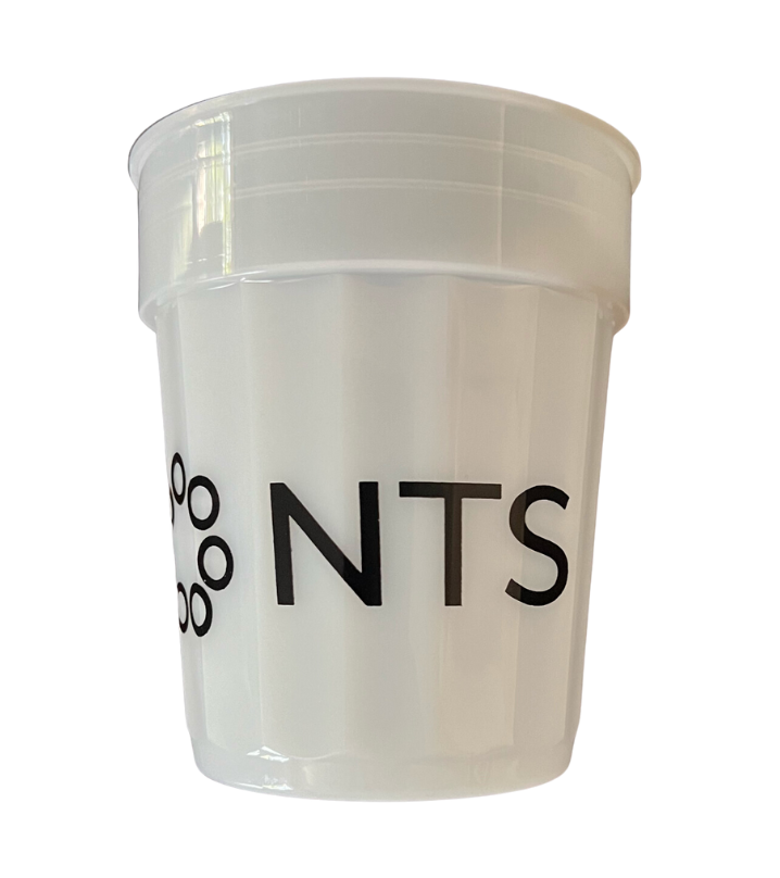 A white plastic cup with the word nts on it