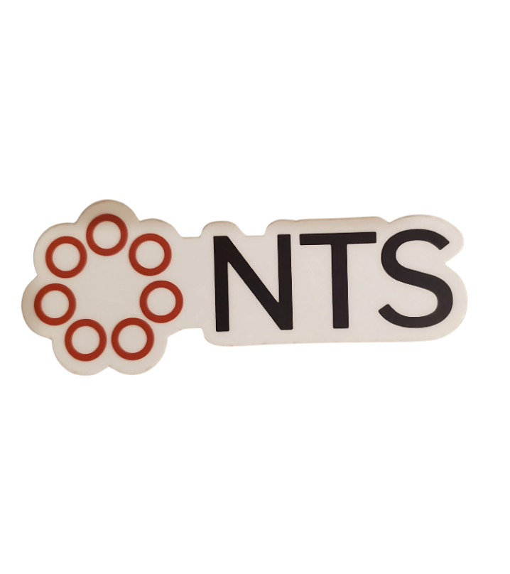 A white sticker with the word nts on it