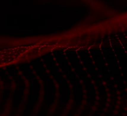 a close up of a red light on a black background .