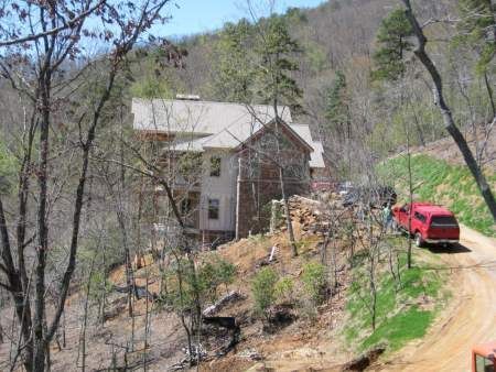 house built on a slope in the mountains at featherstone