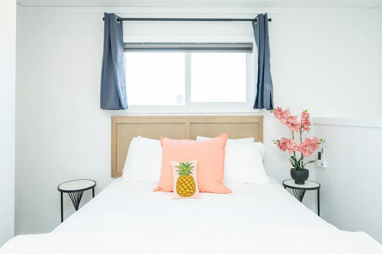 There is a pineapple pillow on the bed in the bedroom.
