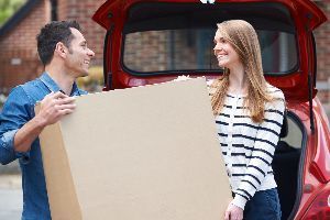 Man And Woman Holding Box | Staunton, VA | American Mini Storage