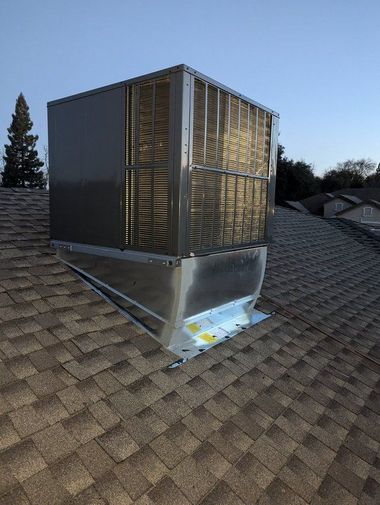 Person using gauges to check an air conditioning unit.
