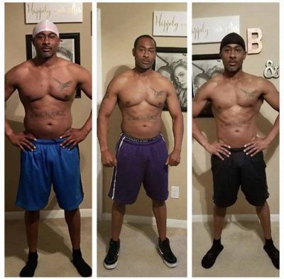 Three men are standing in front of a wall that says happily