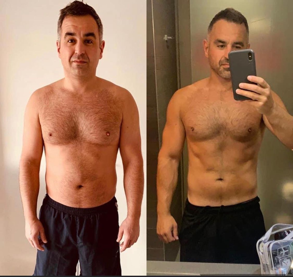 A man is taking a selfie in front of a mirror.