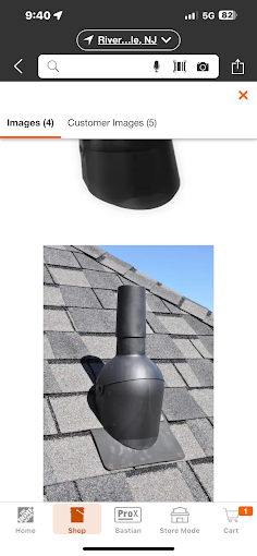A picture of a chimney on a roof on a cell phone.