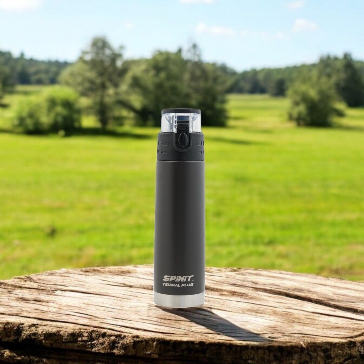 Botella térmica Spinit Termal Plus de color azul y plata con tapa y caja de color negro.