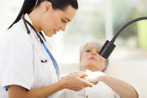 Doctor checking the old woman — Skin Cancer Specialist in Rancho Cucamonga, CA
