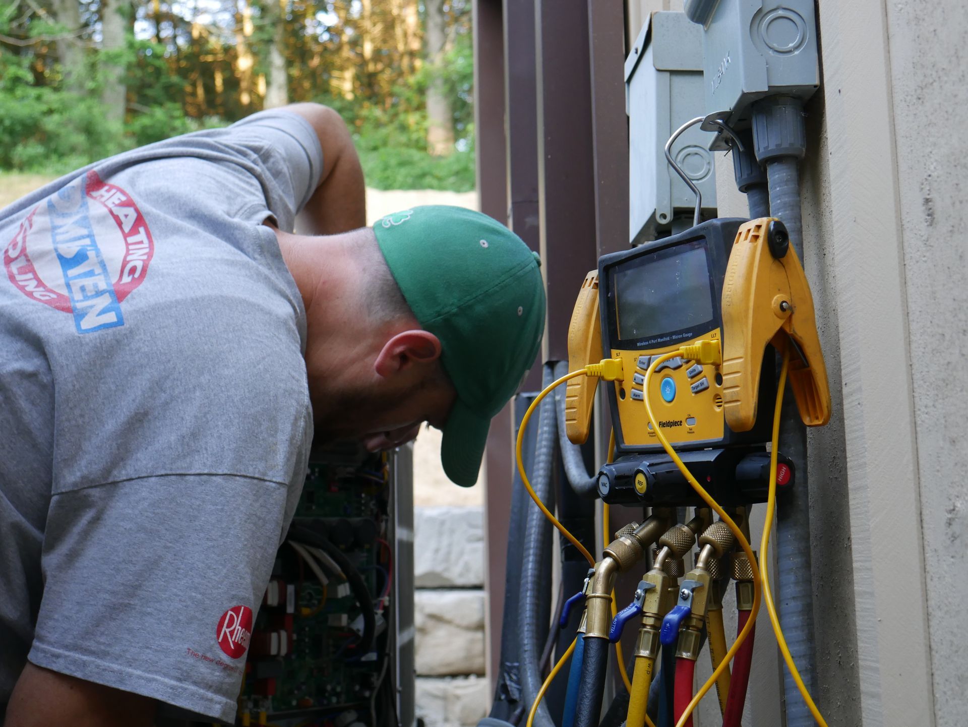 A man wearing a gray shirt with the word eagle on it