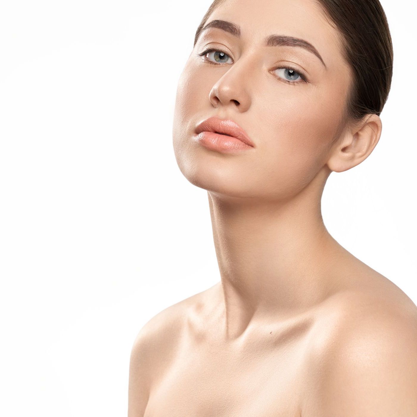 A close up of a woman 's face and neck on a white background.