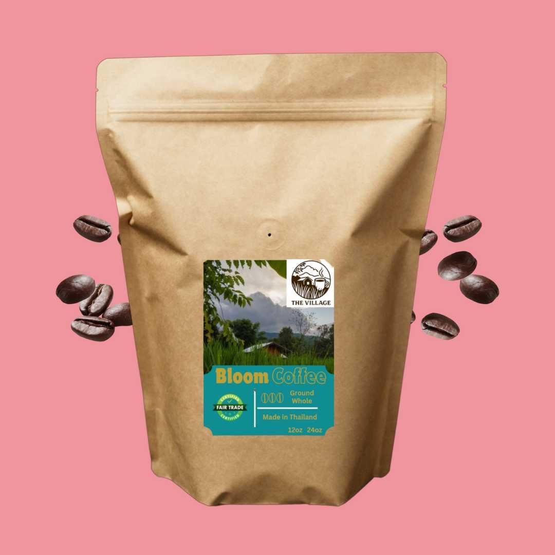 A bag of bloom coffee is on a pink background