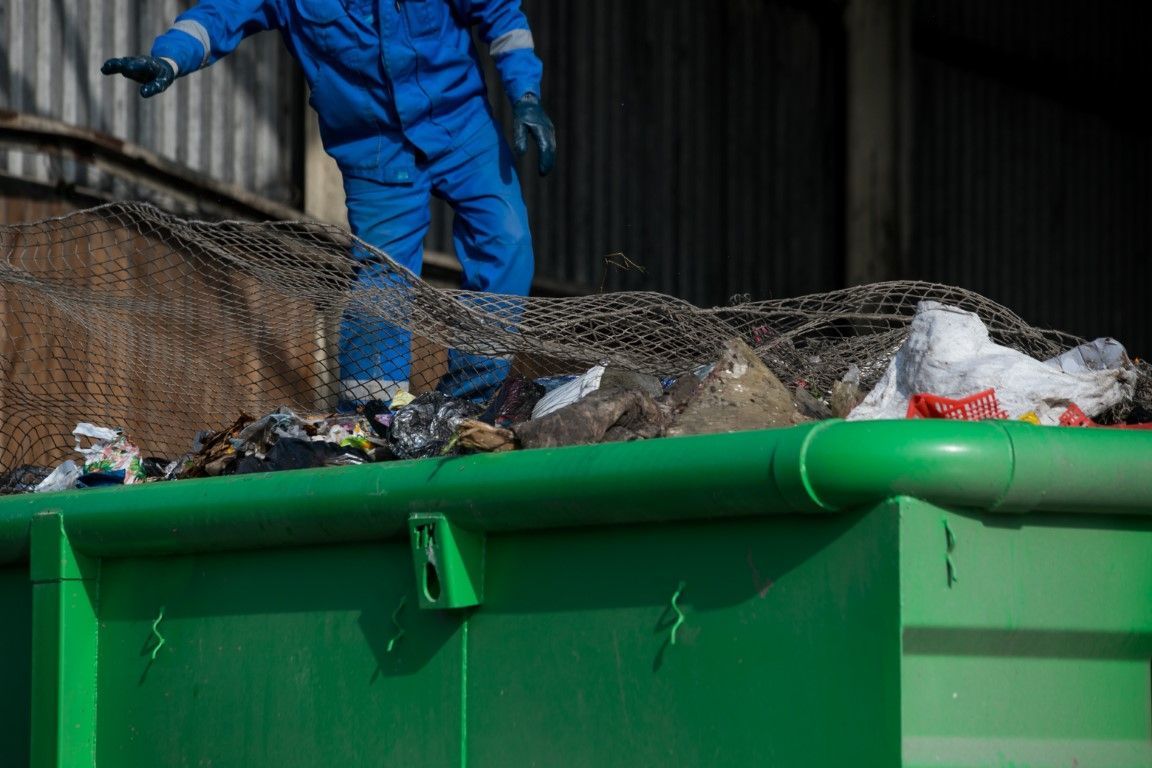 A dumpster of trash and junk being removed in Helena Montana