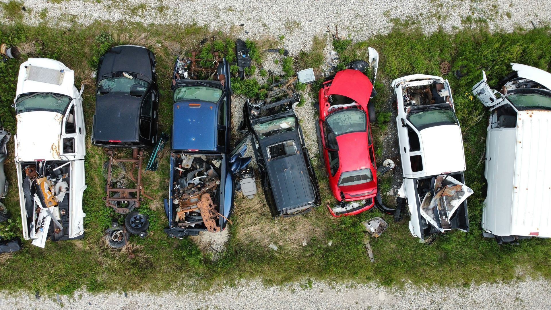 Vehicles ready to be removed to a junk yard for scrap metal.