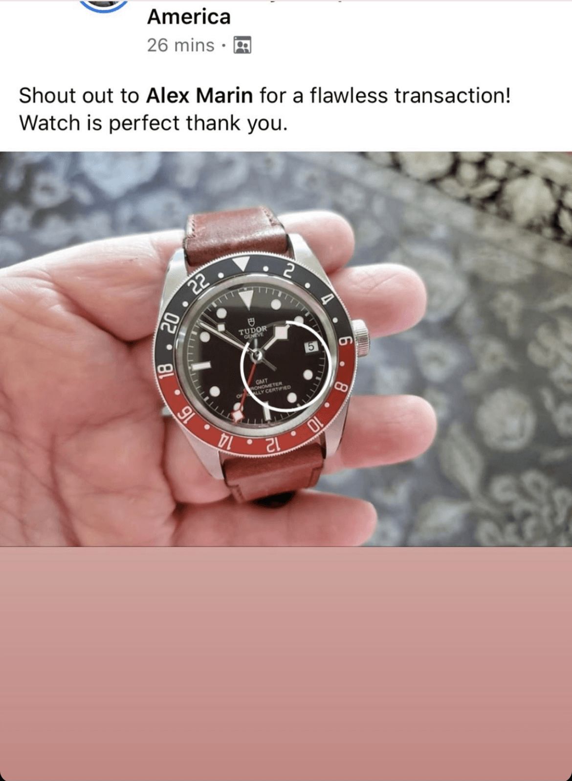 A person is holding a watch in their hand.