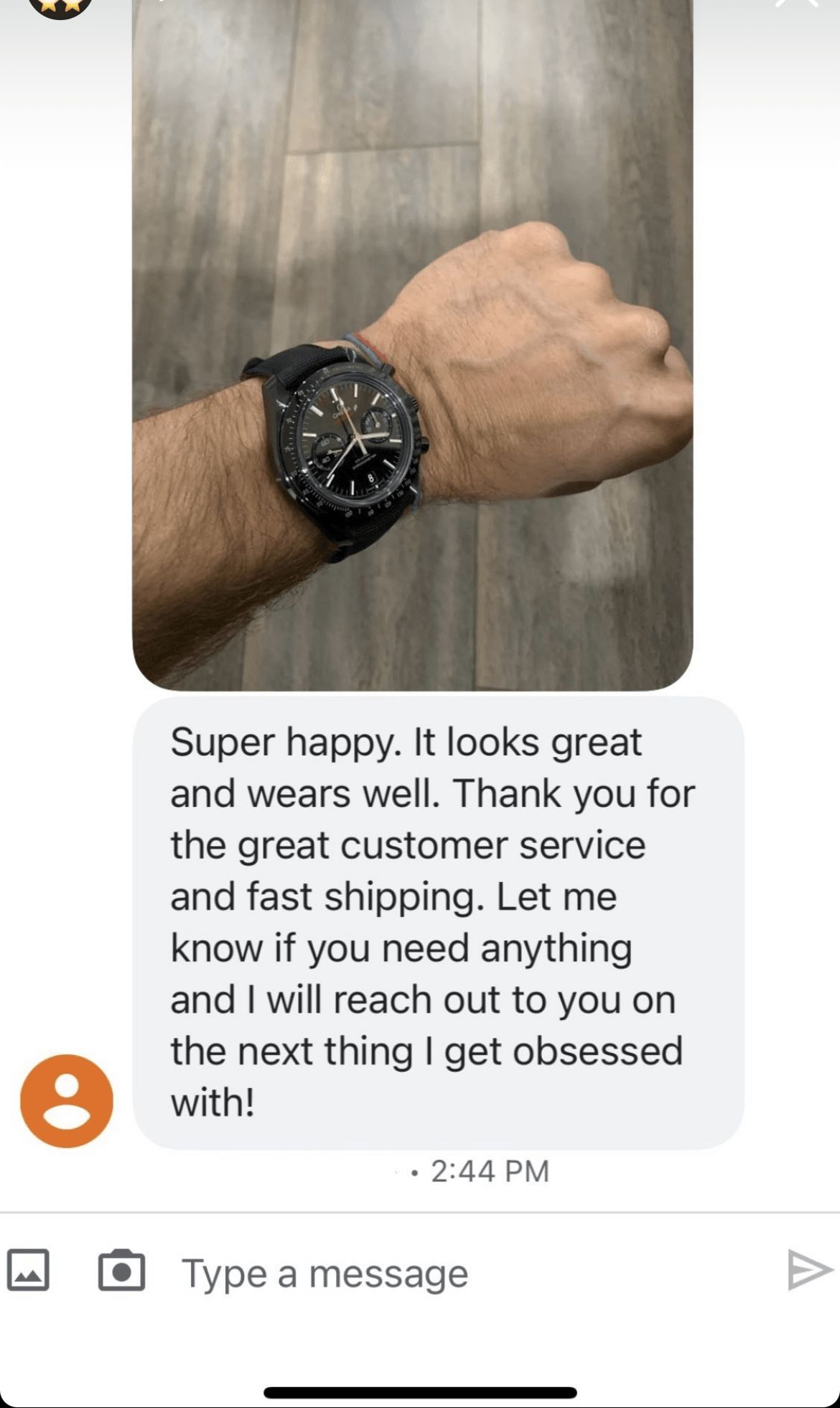 A man is wearing a black watch on his wrist.