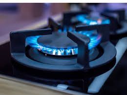 Burning Blue Gas Flame on a Black Stovetop Burner — All Stars Plumbing In Dapto, NSW