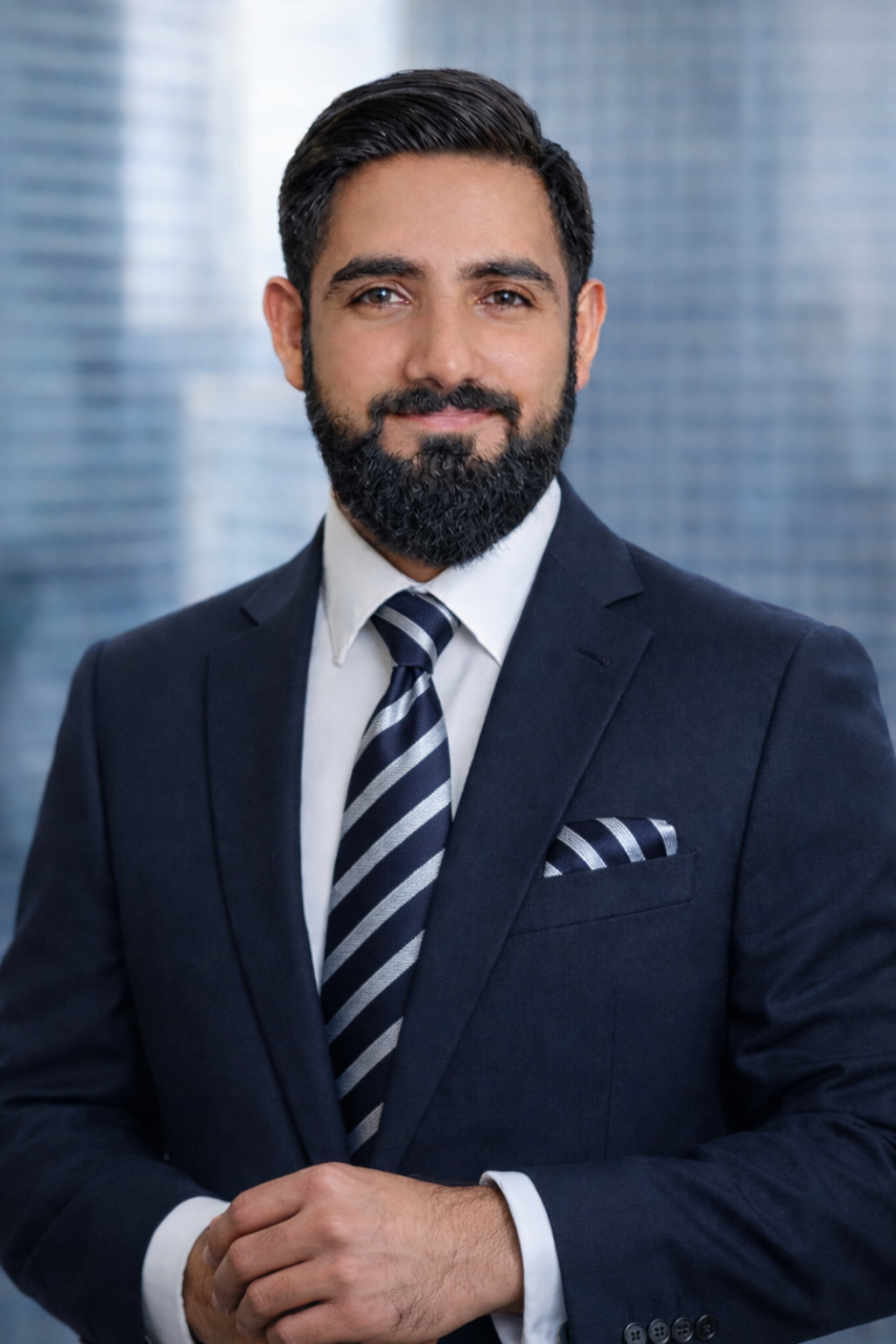 A woman wearing a black shirt and a watch is standing in front of a black background.