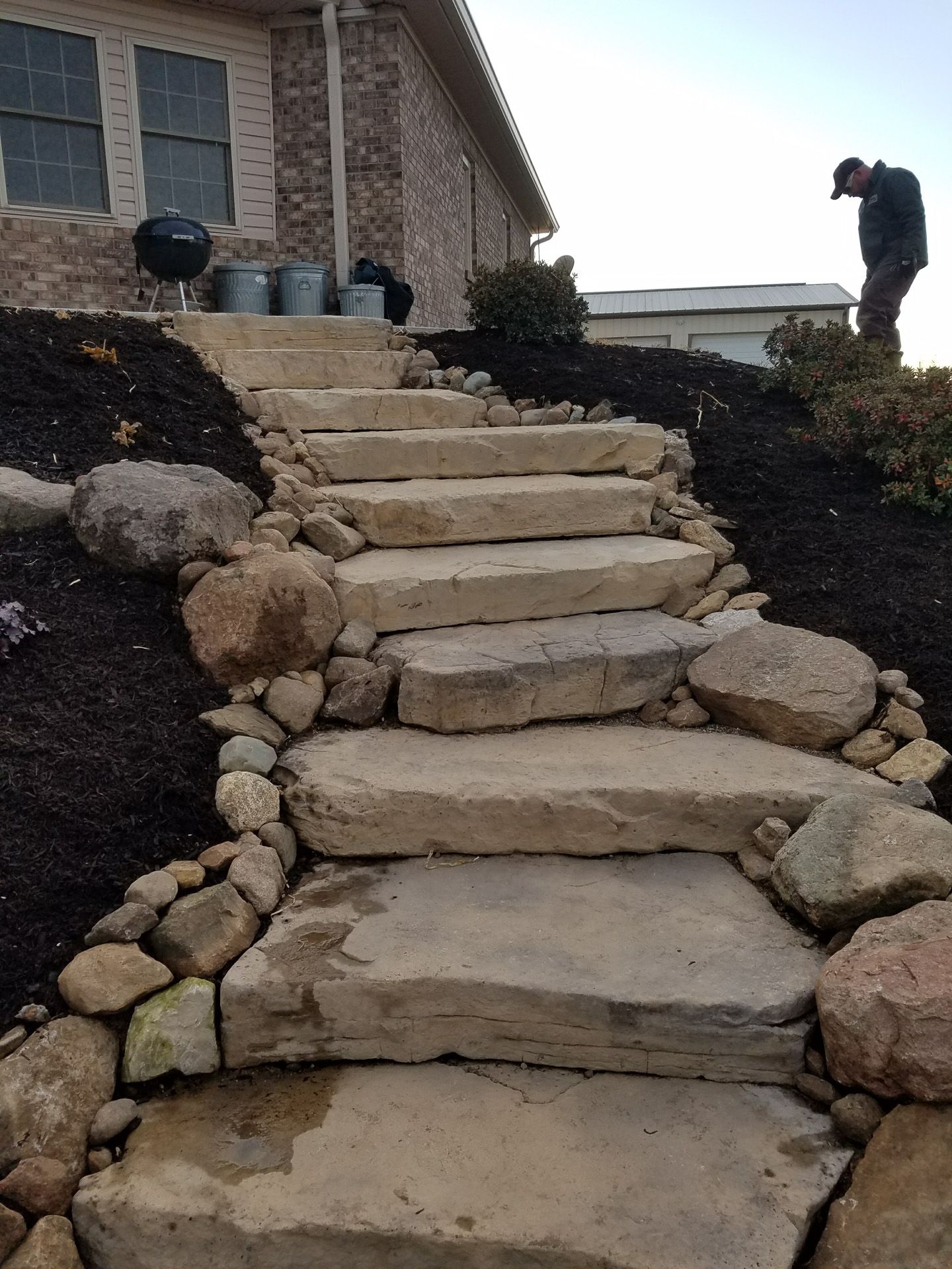 A set of stone stairs leading up to a house