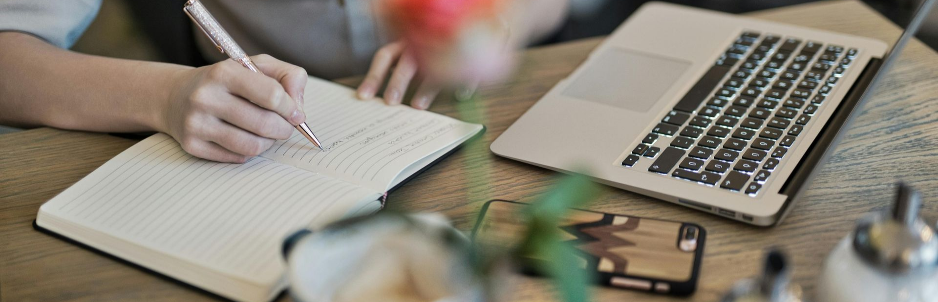 Two pairs of feet stand over text on the ground that reads
