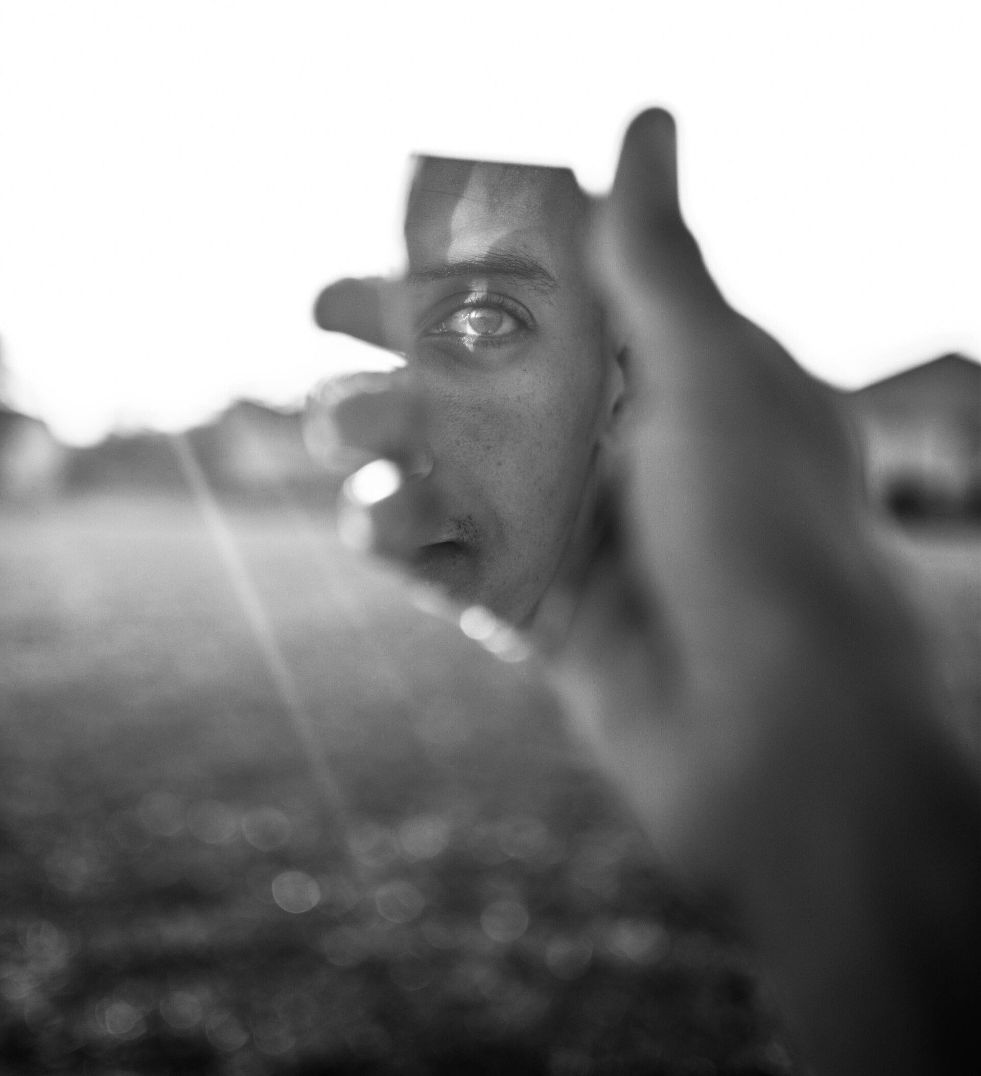 a man looking into the mirror symbolizing the process of self-reflection and growth.