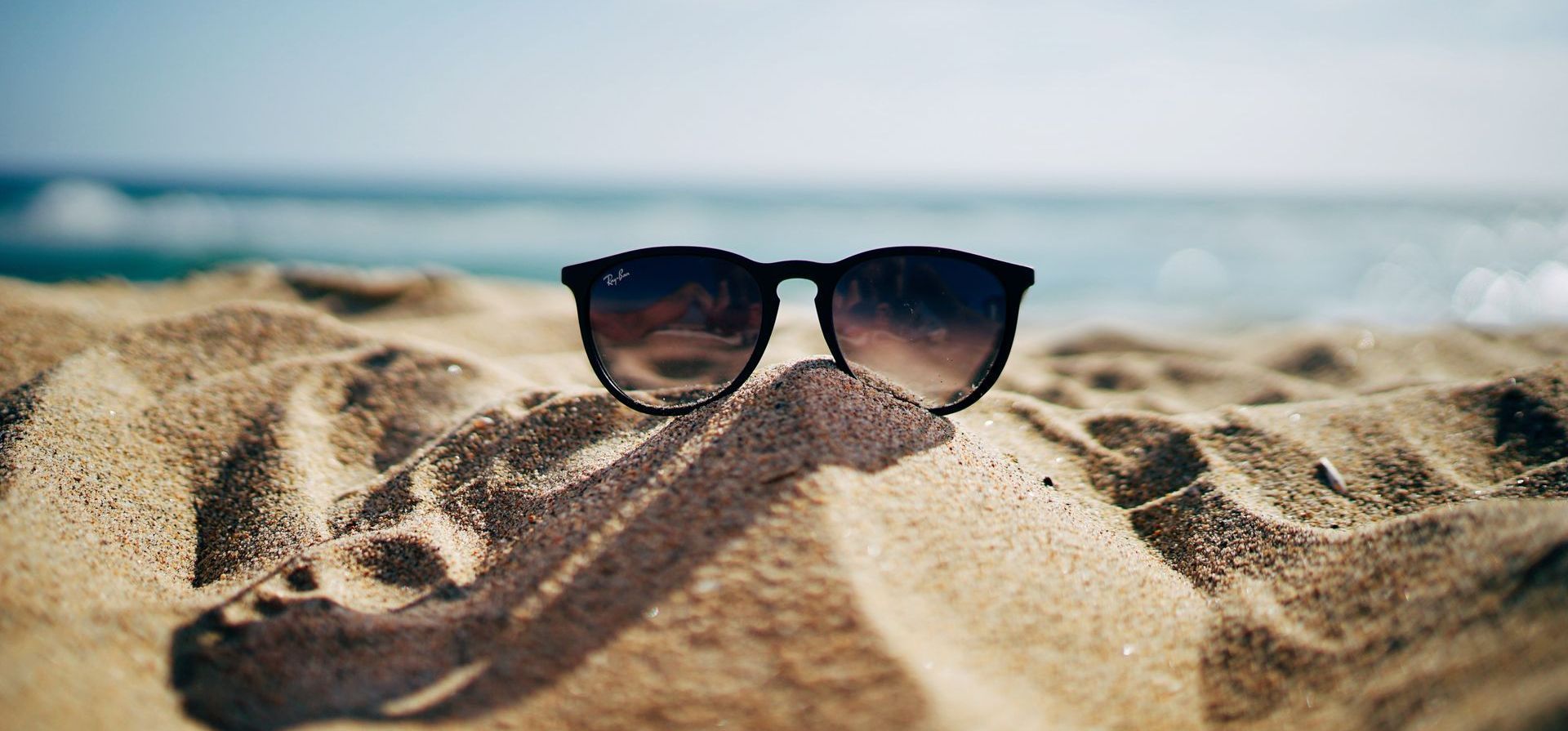 sunglasses in the sand