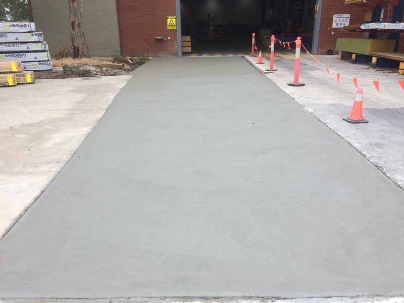 new concrete next to warehouse garage