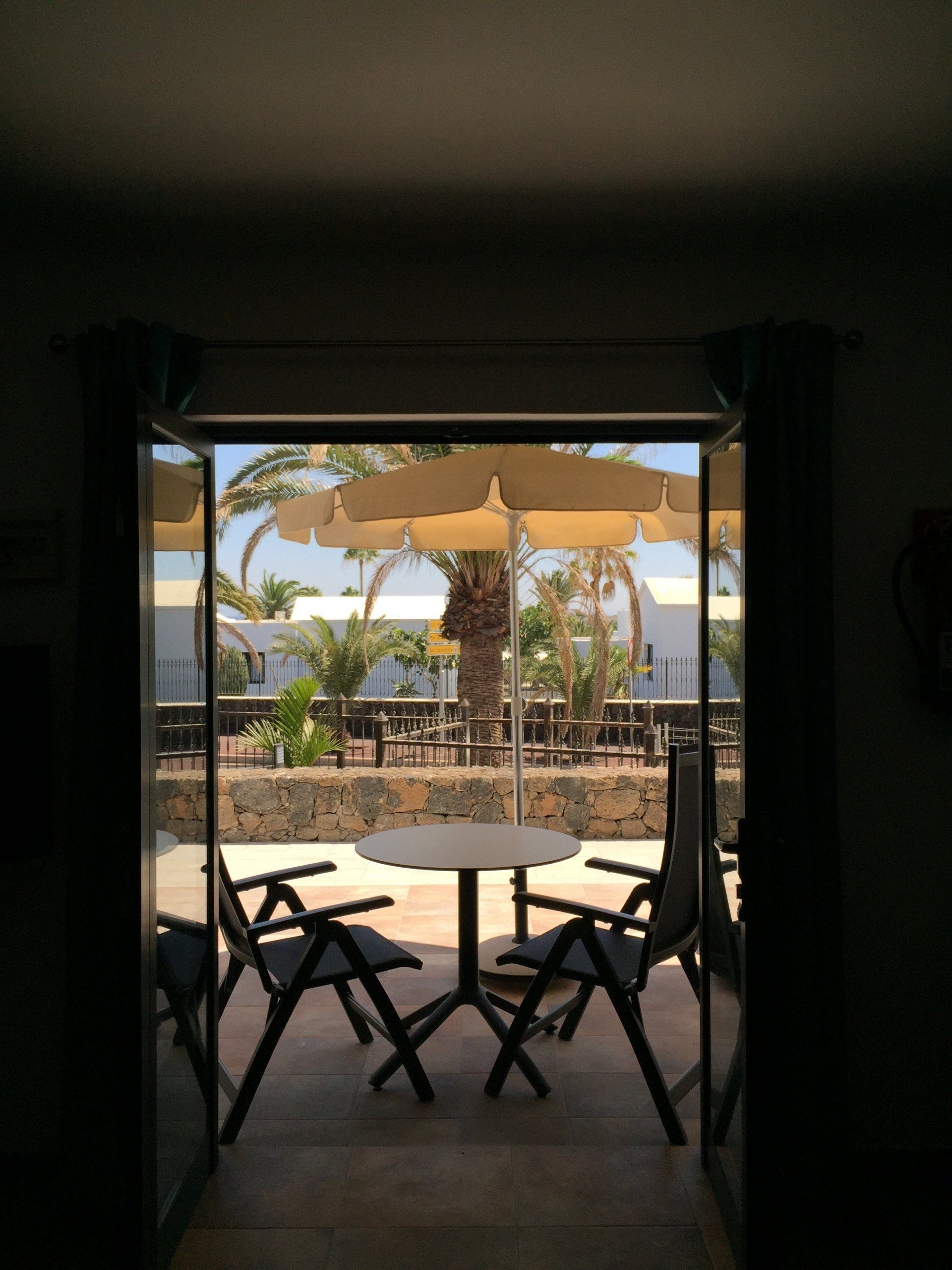 View of the Terrace from the Livingroom of 1-bedroom apartment with garden view at Villa Canaima