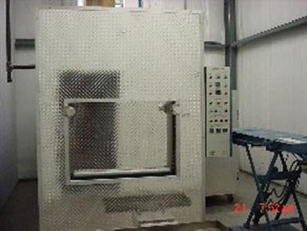 A large white box with holes in it is in a room