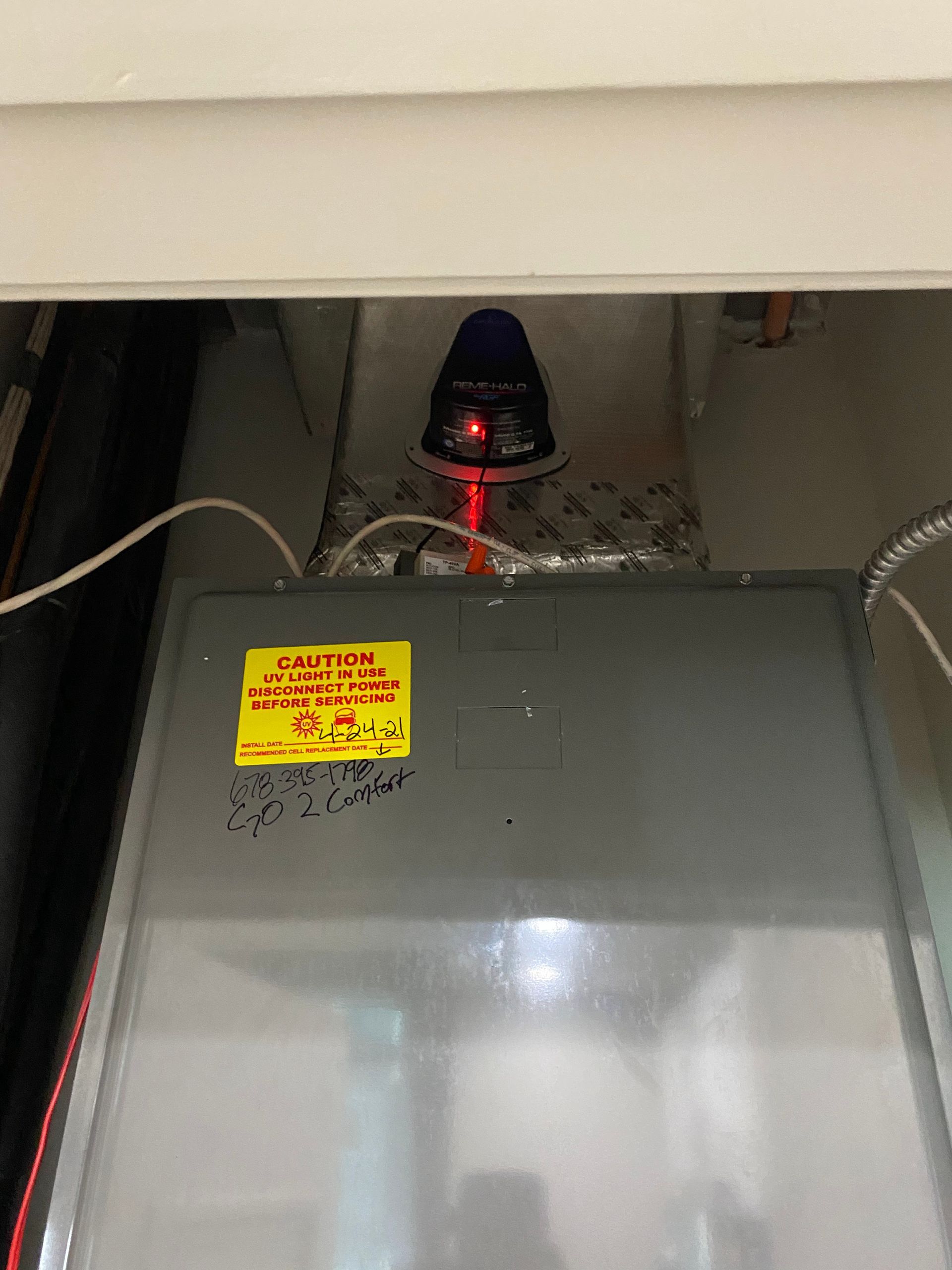 A close up of a machine with a yellow sticker on it.