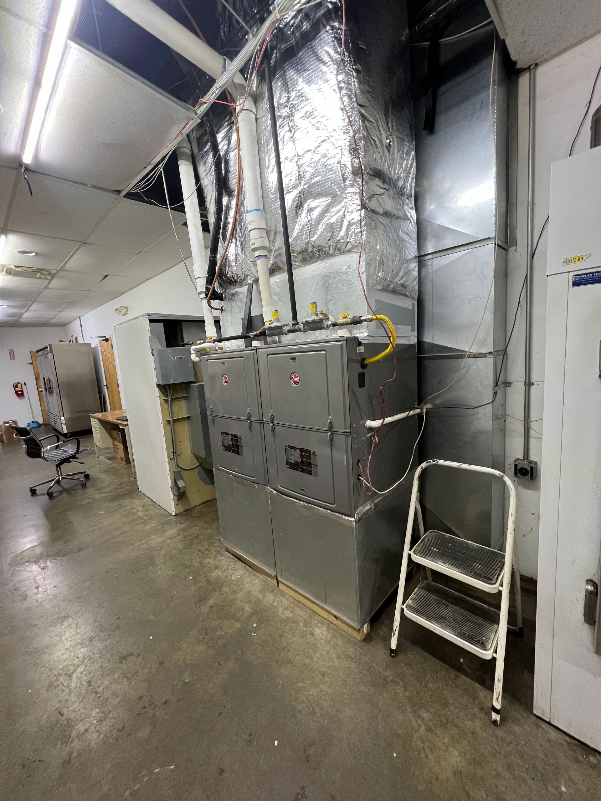 There is a ladder in the corner of the room.